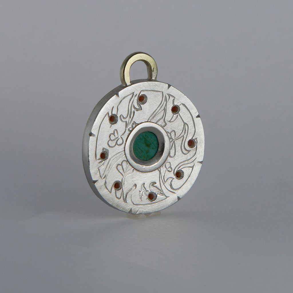 Turquoise and garnet starburst pendant