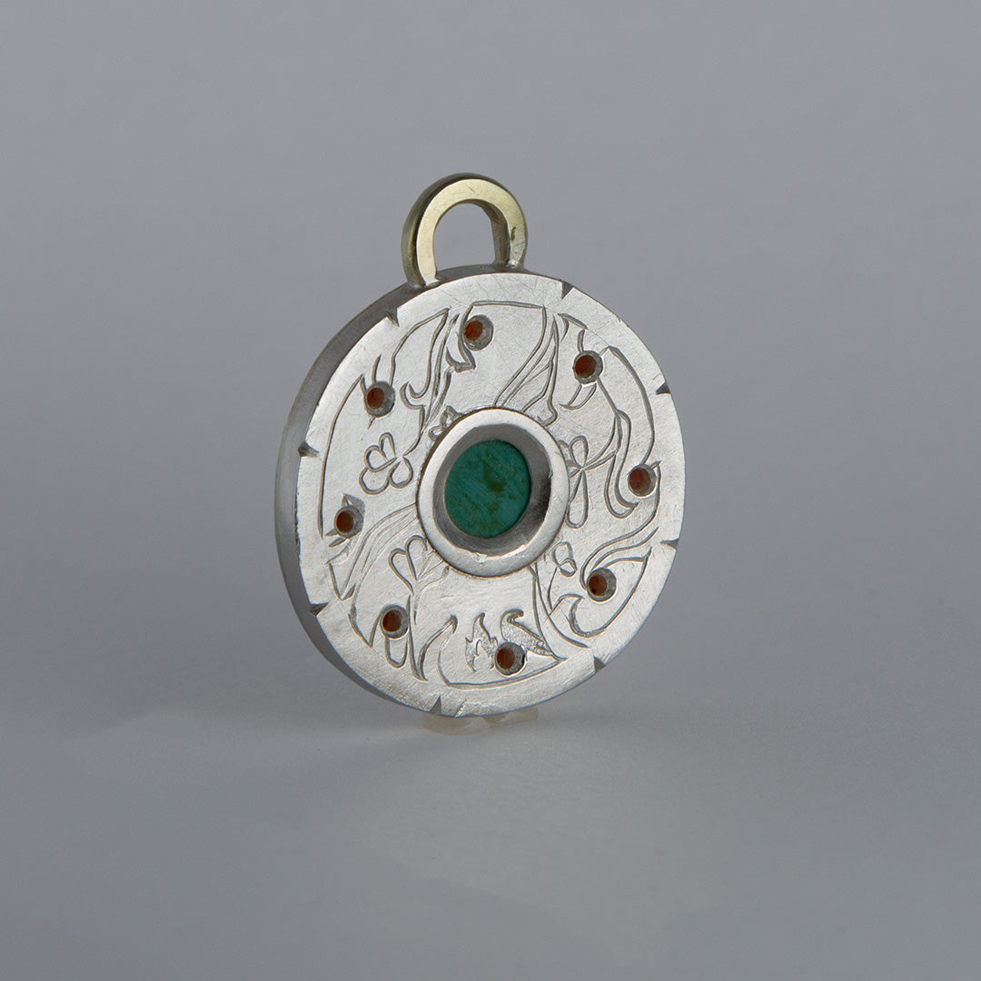 Turquoise and garnet starburst pendant